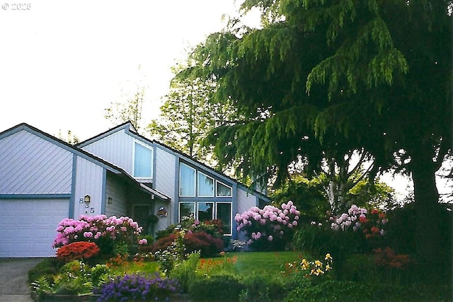 view of side of property with a garage