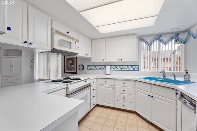 kitchen featuring white cabinetry, white appliances, sink, and light tile patterned floors