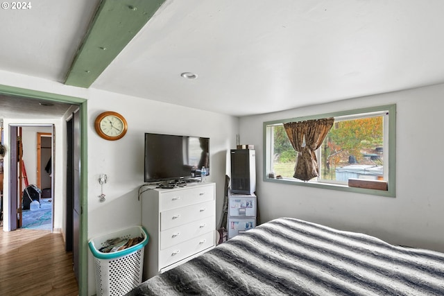 bedroom with dark hardwood / wood-style floors