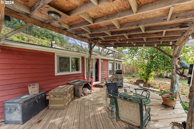 wooden deck with outdoor dining space