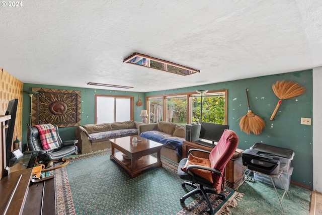 carpeted living room featuring a textured ceiling