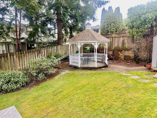 view of yard with a gazebo and a fenced backyard