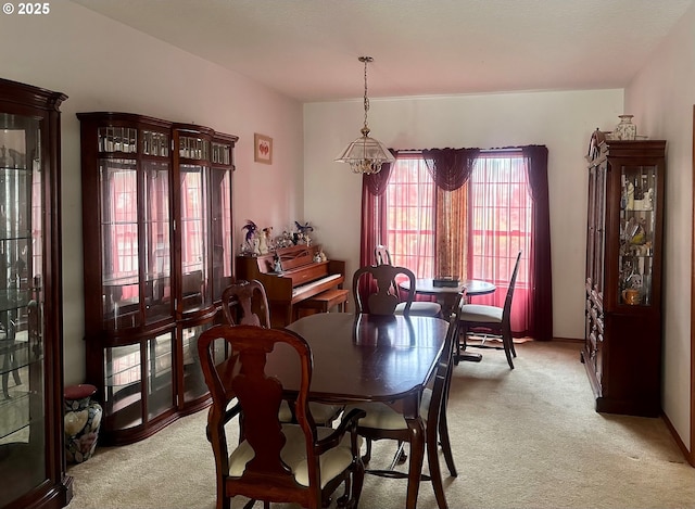 dining room with light carpet