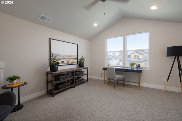 carpeted office with lofted ceiling and ceiling fan