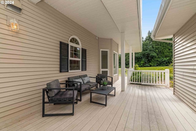 wooden deck featuring an outdoor living space