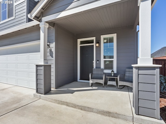 view of exterior entry with a garage