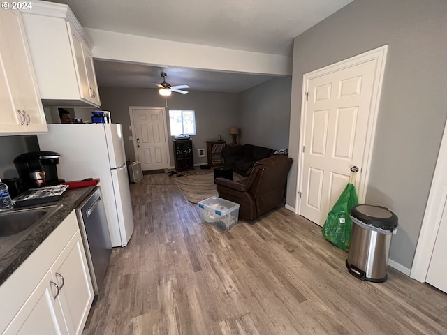 kitchen with light hardwood / wood-style flooring, white cabinetry, sink, dishwasher, and ceiling fan