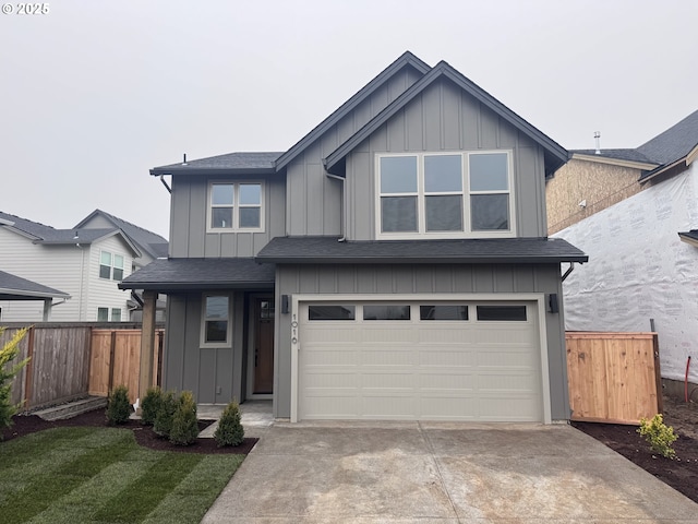 view of front of home featuring a garage and a front lawn