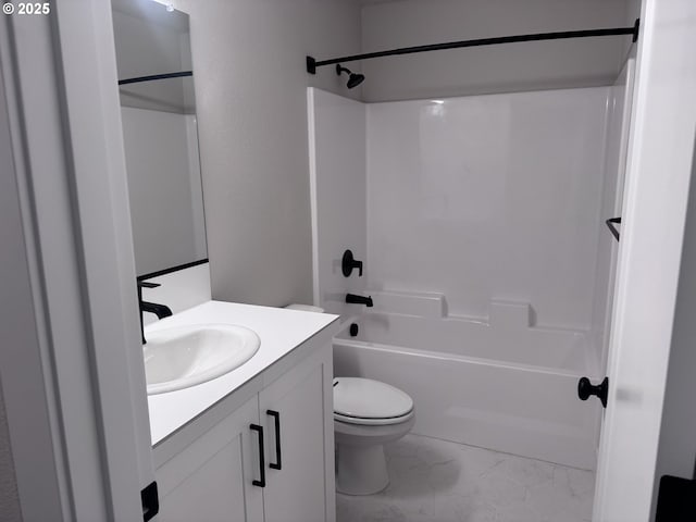 full bathroom featuring toilet, vanity, and bathtub / shower combination