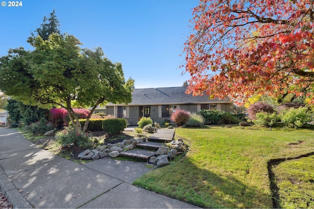 single story home with a front yard