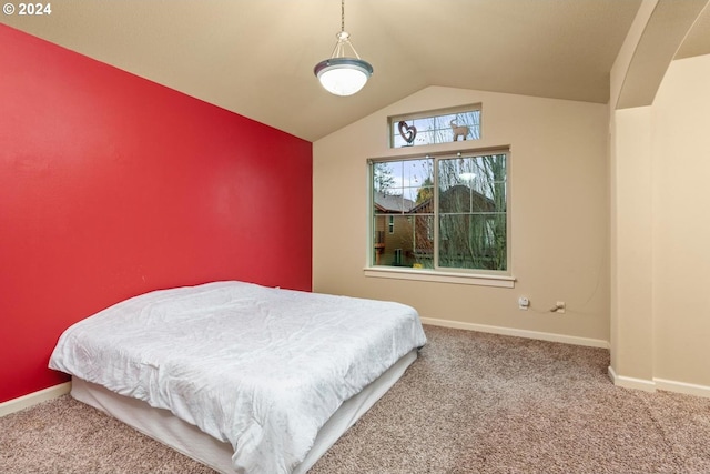 bedroom featuring carpet flooring and lofted ceiling