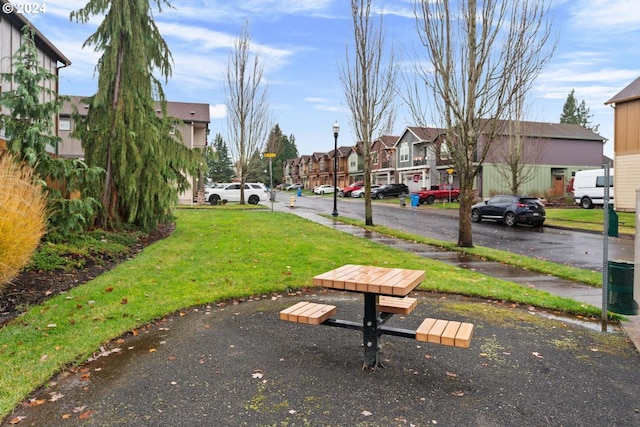 view of home's community with a lawn