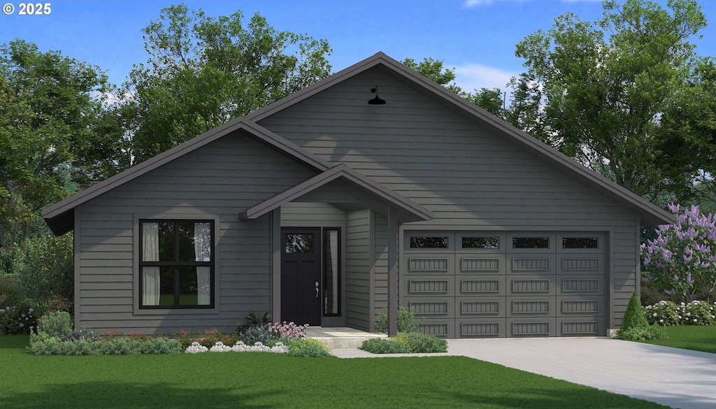 view of front of house featuring a front yard and a garage