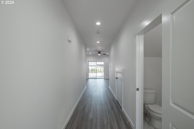 hallway with dark hardwood / wood-style flooring