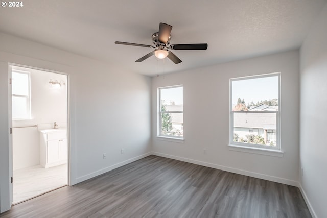 unfurnished room featuring ceiling fan, light hardwood / wood-style floors, and a healthy amount of sunlight