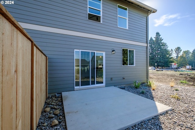 rear view of property featuring a patio area