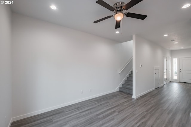 unfurnished living room featuring wood-type flooring and ceiling fan