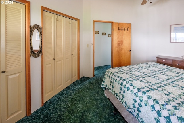 bedroom with dark colored carpet, ceiling fan, and a closet