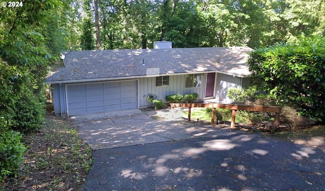 single story home with a garage