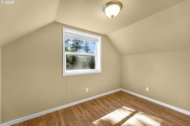 12312 NE Brazee St, Portland, OR 97230 - additional living space featuring wood finished floors and vaulted ceiling
