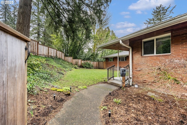 view of yard with a fenced backyard