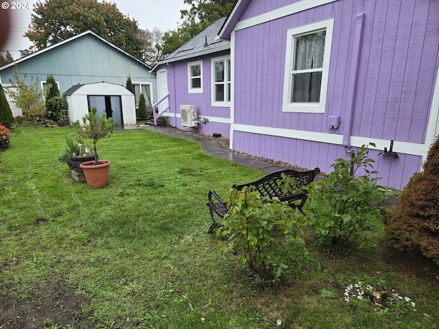 view of yard with ac unit and a shed