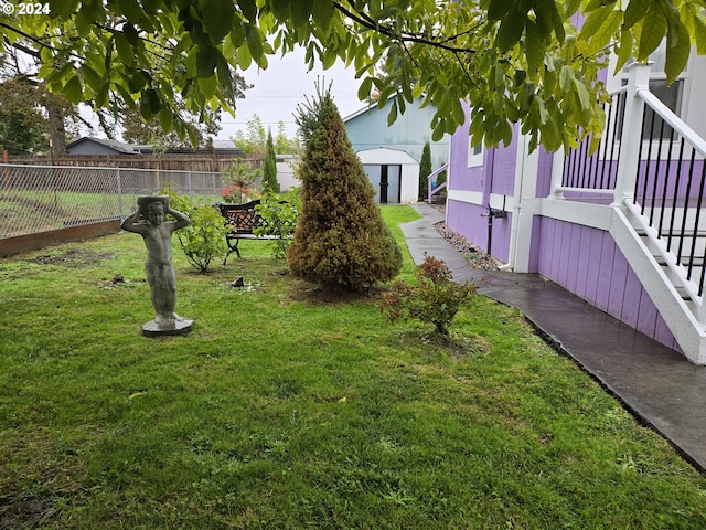 view of yard with a storage unit