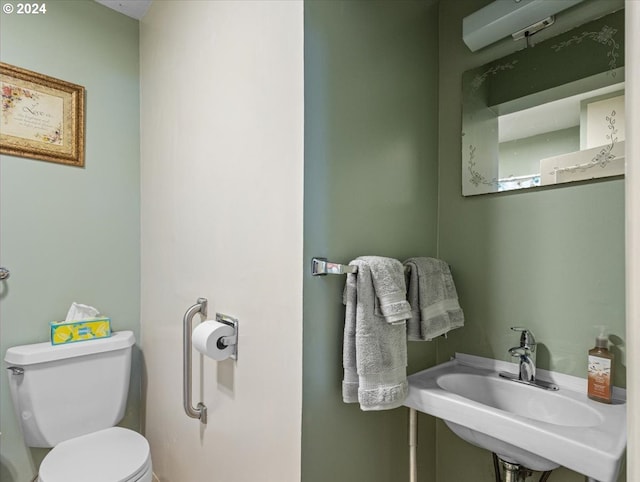 bathroom with sink and toilet