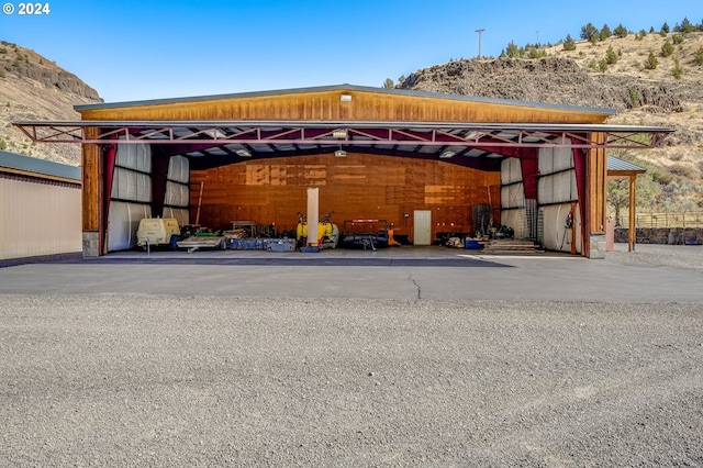 view of car parking featuring a mountain view