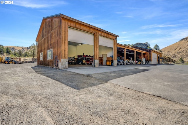 view of outdoor structure featuring a garage and a mountain view