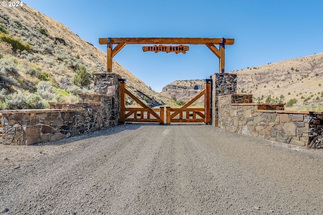 view of gate featuring a mountain view