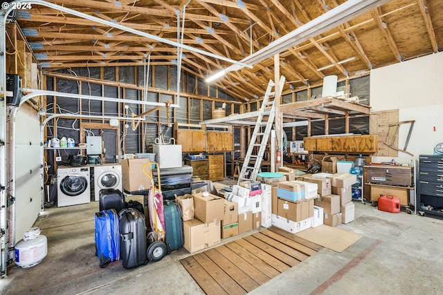 storage area featuring washing machine and clothes dryer