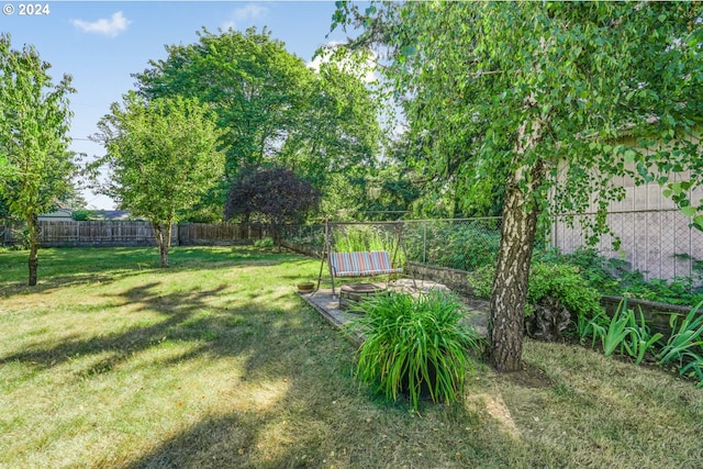 1730 SE 148th Ave, Portland, OR 97233 - view of yard featuring a fenced backyard and a fire pit