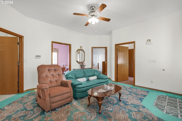 living room featuring ceiling fan and carpet flooring