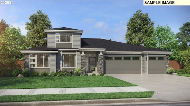 view of front of property featuring a front lawn and a garage