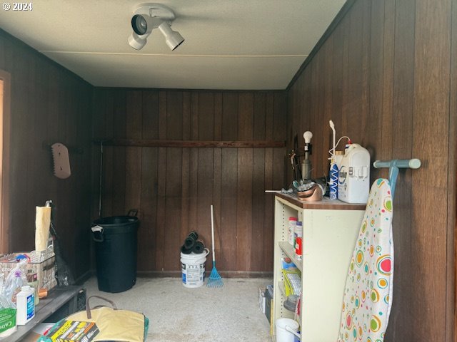 205 N Humbolt St, Canyon City, OR 97820 - misc room featuring carpet and wood walls