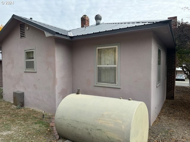 205 N Humbolt St, Canyon City, OR 97820 - view of side of property with metal roof and stucco siding