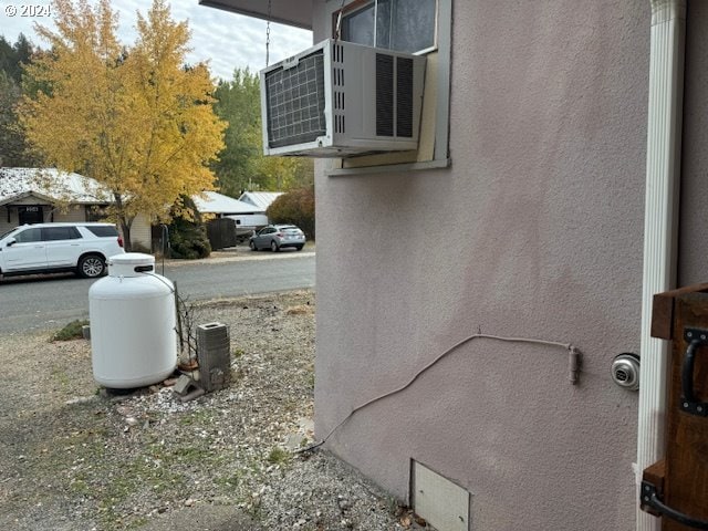 205 N Humbolt St, Canyon City, OR 97820 - view of home's exterior with stucco siding and ac unit