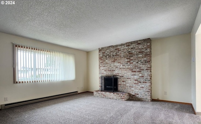 unfurnished living room featuring a brick fireplace, carpet floors, a textured ceiling, and a baseboard heating unit