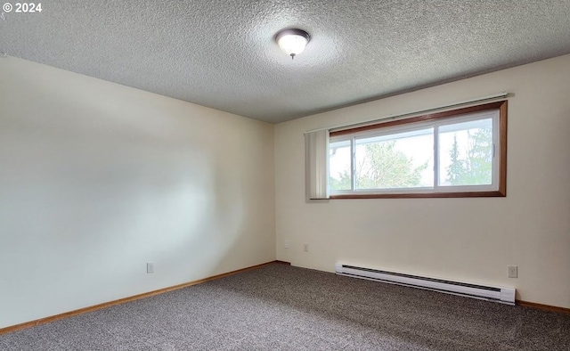 carpeted empty room featuring baseboard heating and a textured ceiling