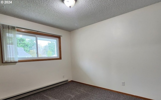 carpeted spare room with a textured ceiling and a baseboard radiator