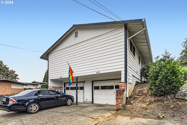 view of property exterior with a garage