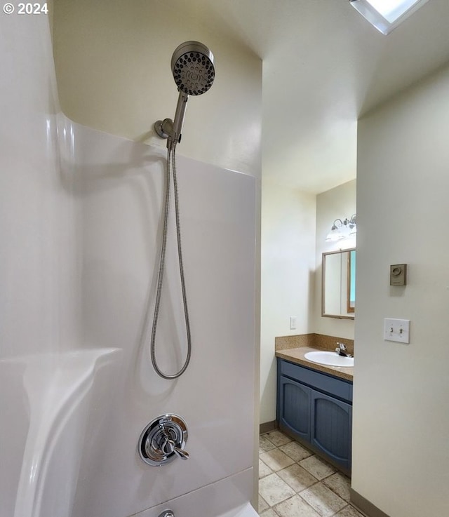 bathroom with tile patterned floors and vanity