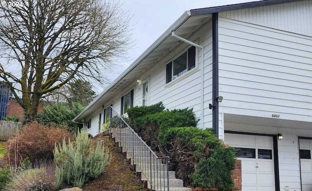 view of property exterior featuring a garage