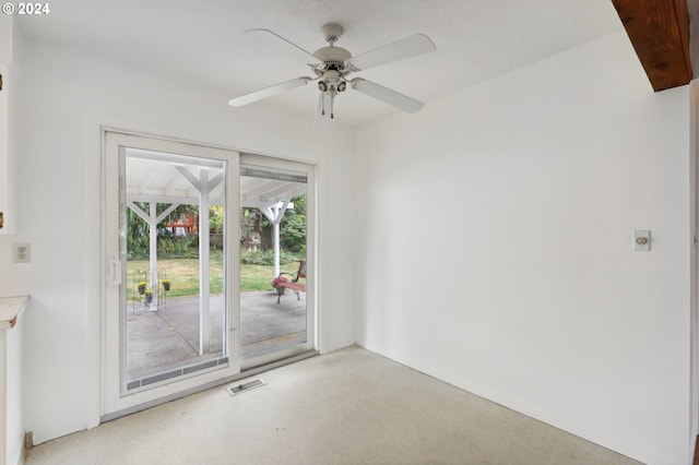 empty room featuring visible vents and ceiling fan