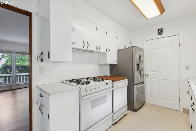 kitchen featuring white appliances, light hardwood / wood-style flooring, and white cabinetry