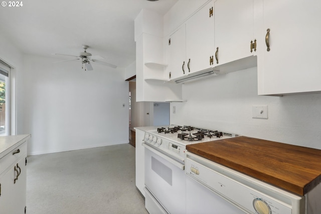 kitchen featuring white cabinetry, white gas range, and ceiling fan