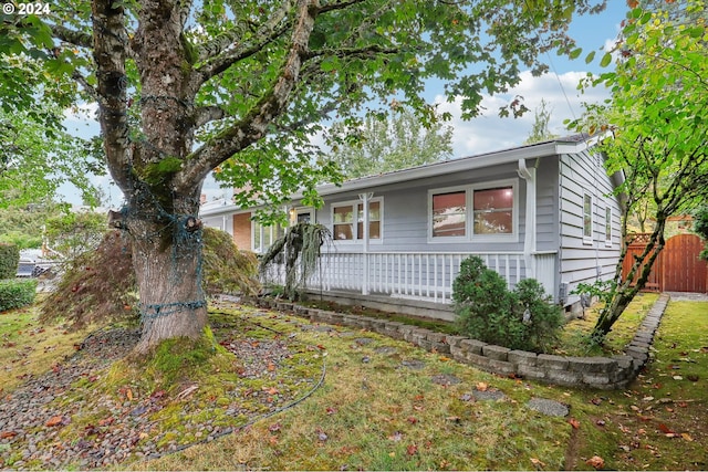 single story home with fence