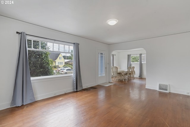 empty room with hardwood / wood-style flooring