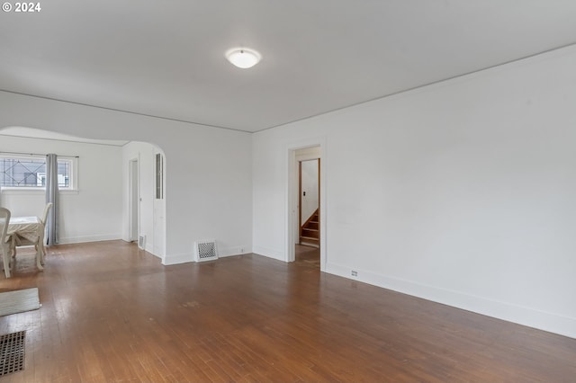 spare room with dark hardwood / wood-style flooring